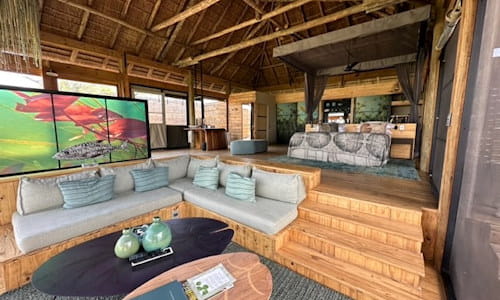 Lodging accommodations in Botswana - living area and stairs leading to bedroom