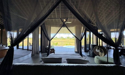 Lodging accommodations in Botswana - bed overlooks Safari