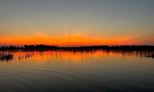 Sunset over water, Botswana