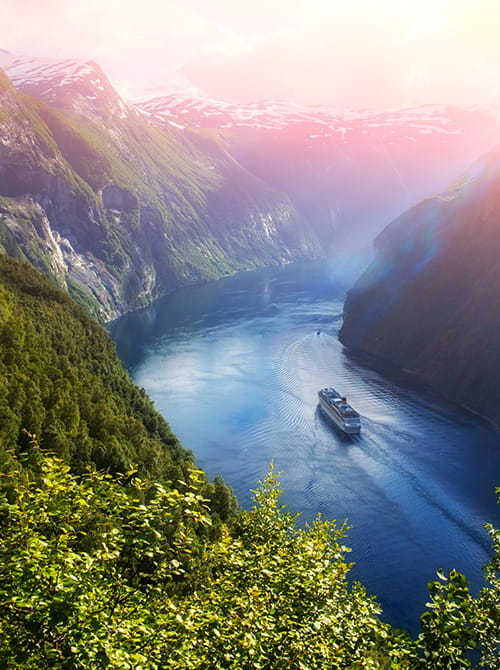 Sunnylvsfjorden fjord and Seven Sisters waterfalls, near Geiranger village in western Norway.